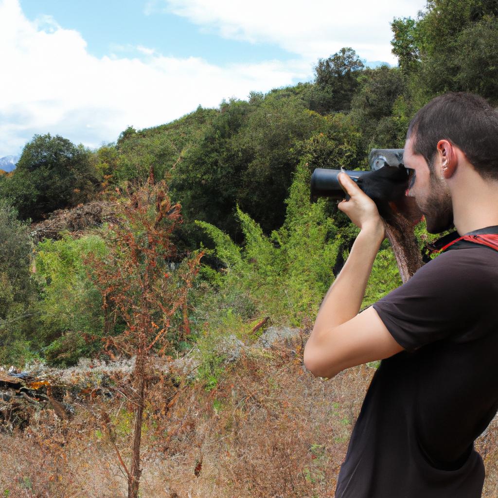 Person photographing natural landscape scene