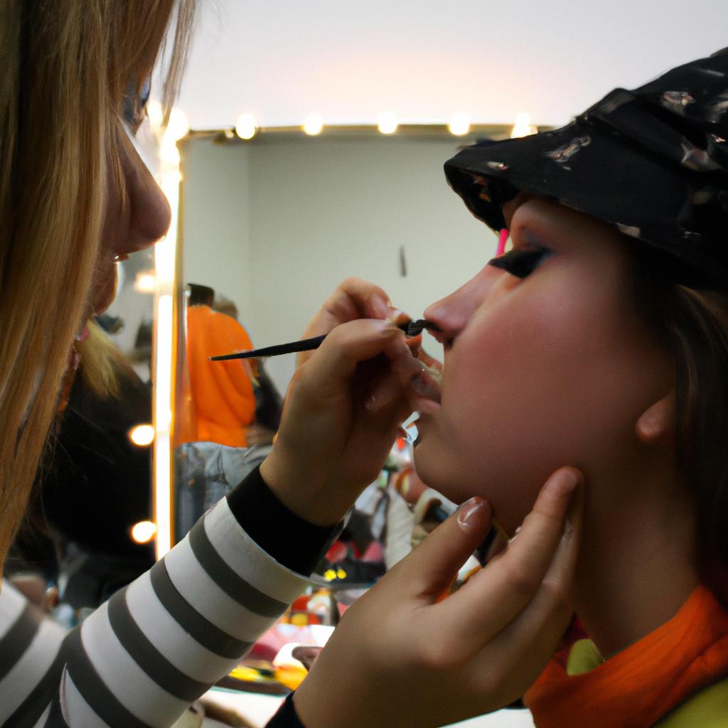 Person applying stage makeup backstage